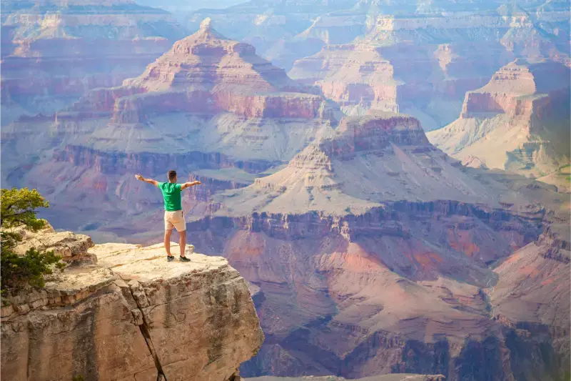 Grand Canyon Hiker On Rocky Overlook Arizona